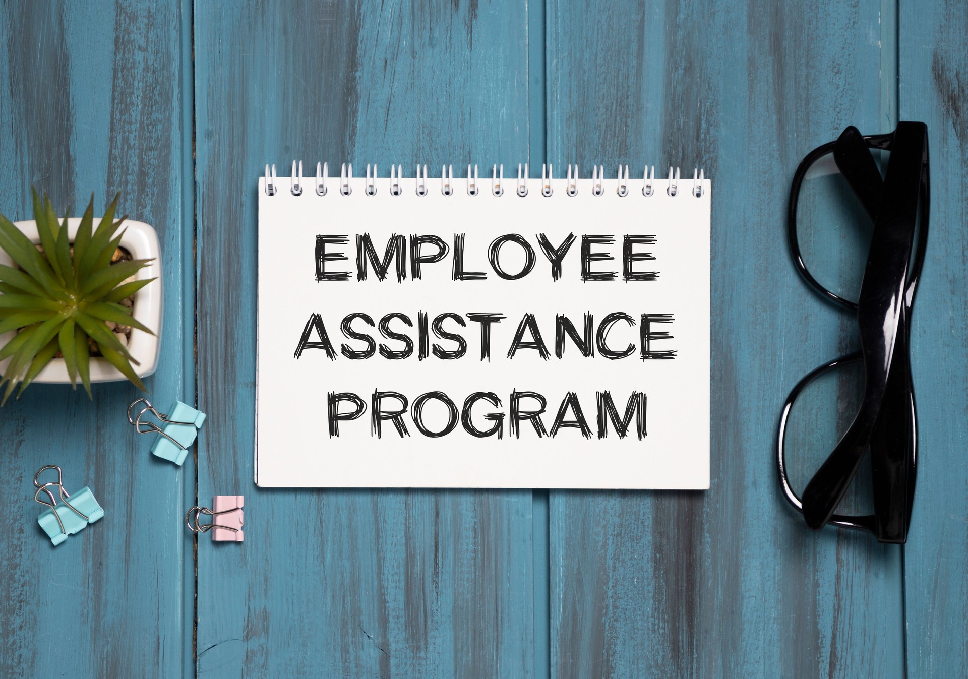 Employee Assistance Program text on notepad, business text concept.